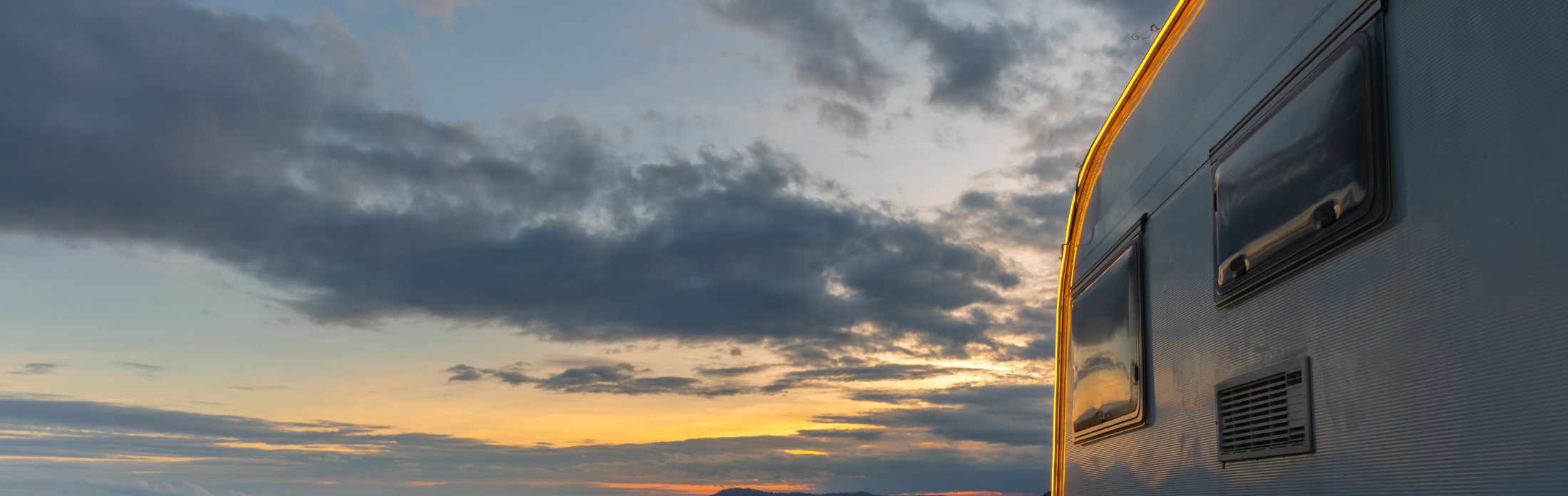 Campsite with caravans at dusk time